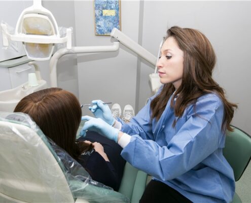 Dr. Feldman - dentist working on patient