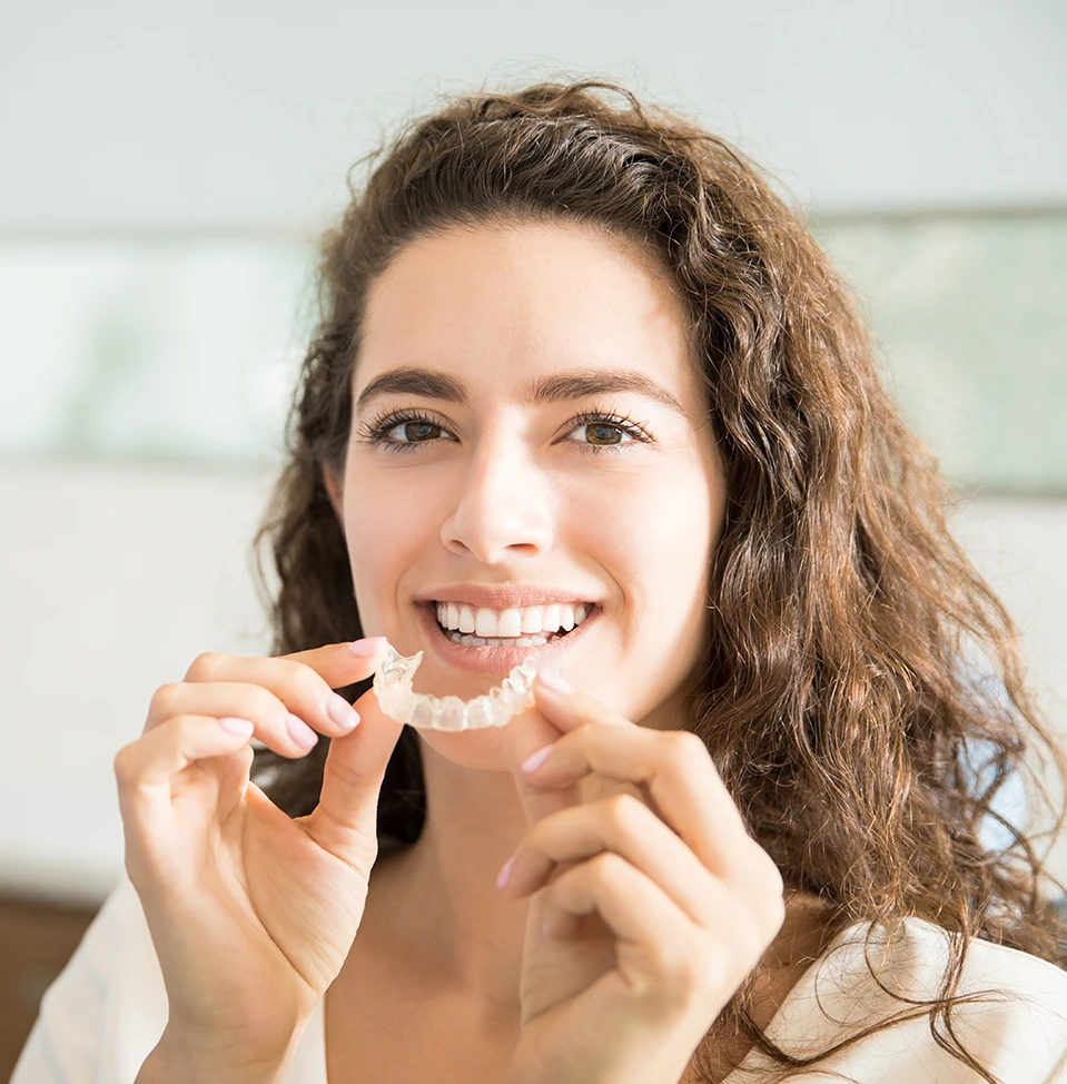 a women holing invisalign